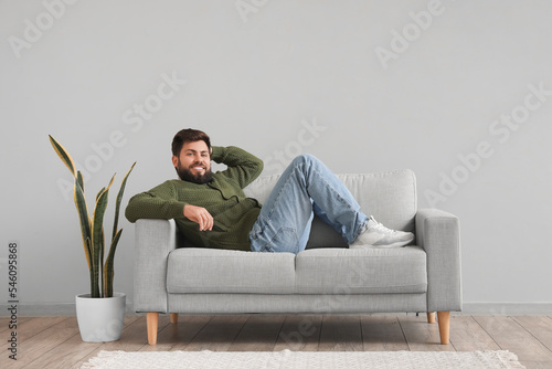 Handsome bearded man lying ...