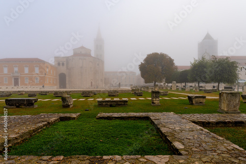 Roman forum and church of St. Donat on a foggy morning in Zadar, Croatia photo