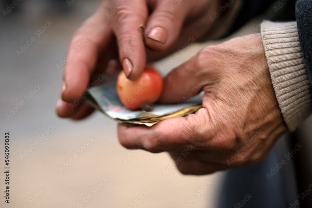 Hands of a poor person closep, holding banknotes. Hands of a poor person closep, holding banknotes.