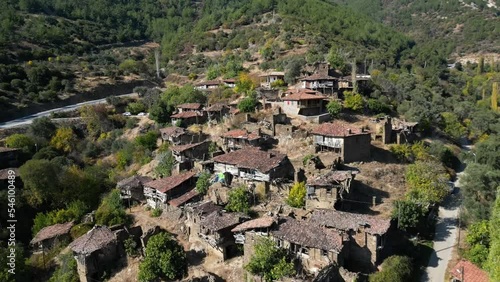 Drone backwards moving footage of abandoned lubbey village aka camyayla village in izmir ,turkey