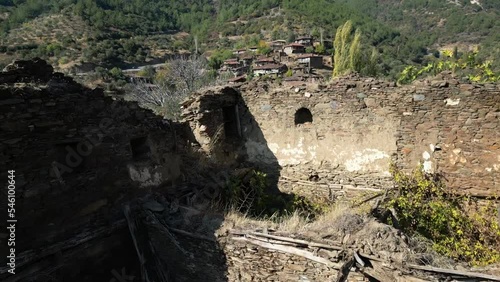 Footage starts by moving up from a ruin view then flies over the abandoned lubbey village aka camyayla village in izmir ,turkey