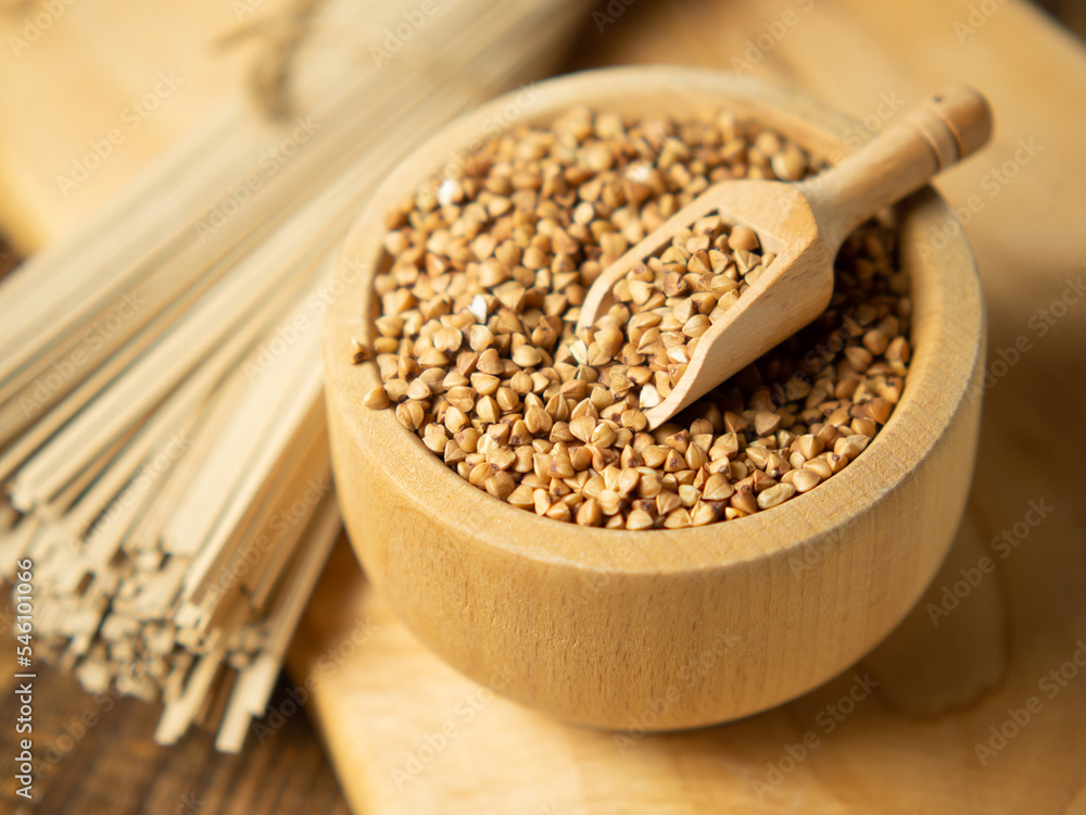 buckwheat noodles and buckwheat groats on a wooden background, rustic composition with buckwheat buckwheat noodles and buckwheat groats on a wooden background, rustic composition with buckwheat