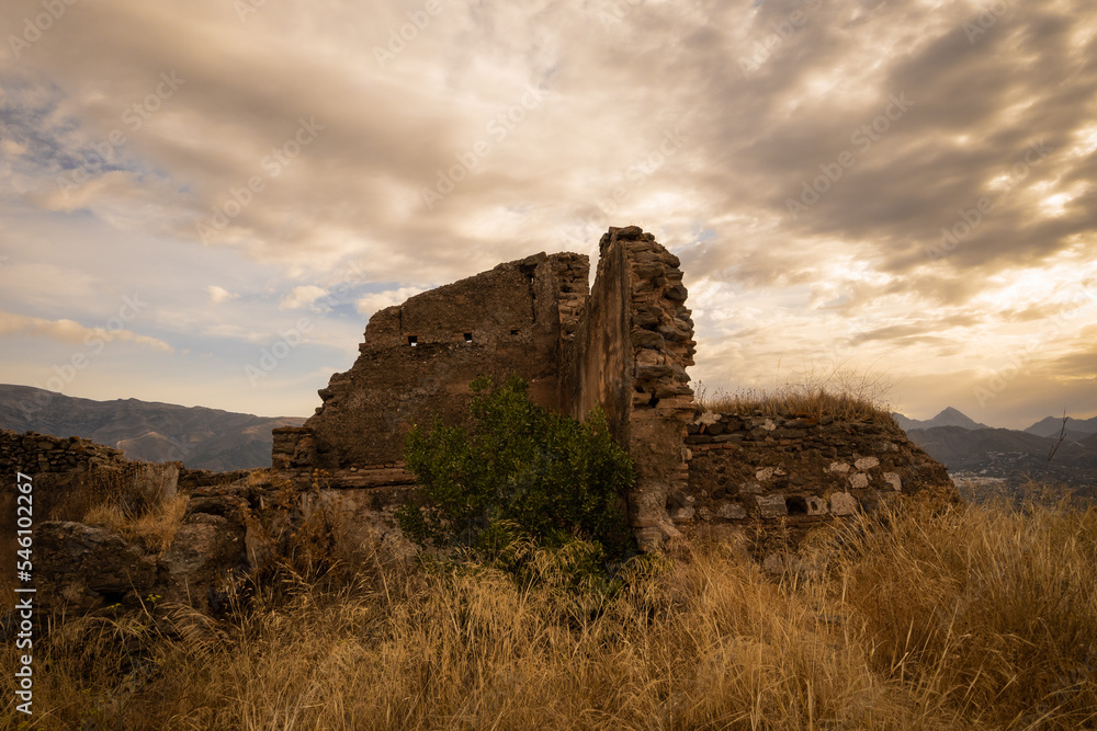 The remains of Bentomiz castle which was a moorish constructed fort on the top of a hill near Arenas in the mountains of Andalusia above Malaga. Spanish name is Castillo Bentomiz