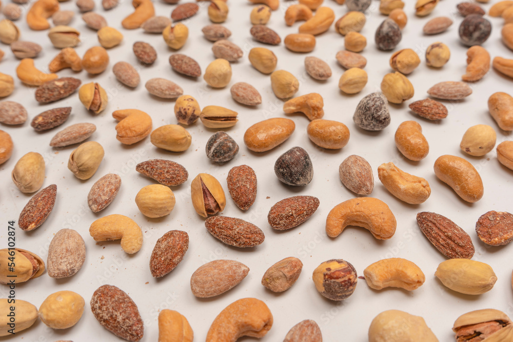 A group of almonds, pistachios, walnuts, macadamia, cashews. A group of almonds, pistachios, walnuts, macadamia, cashews.