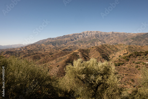 A view of spanish mountains taken from the hill above Arenas in Malaga  Andalusia. These rocky looking mountains are scattered with holiday homes and farms for crops like figs and olives