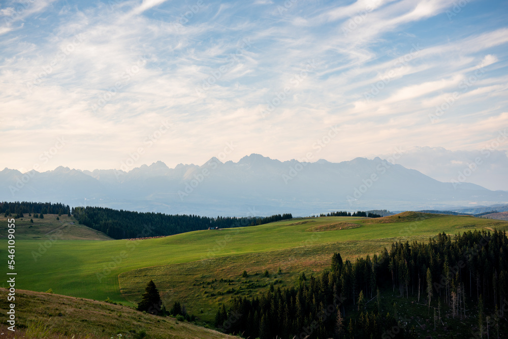 Naklejka premium High Tatras from Panska Hola, Low Tatras National Park Slovakia.Green meadows and mountains in the background.