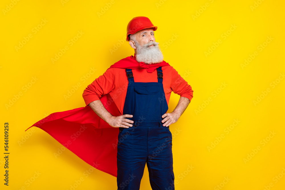 Photo of confident cool old guy dressed uniform overall red hardhat mantle ready help empty space isolated yellow color background