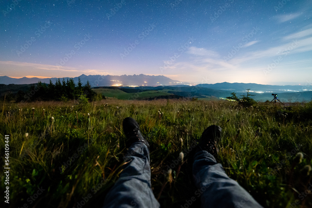 Night view of High Tatras from Panska Hola, Low Tatras National Park Slovakia.Green meadows and mountains in the background. Sitting under the night sky. Night view of High Tatras from Panska Hola, Low Tatras National Park Slovakia.Green meadows and mountains in the background. Sitting under the night sky.