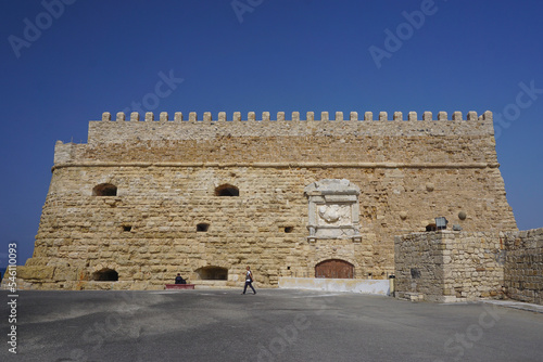 Heraklion, Crete, Greece: Tourists explore the Castello a Mare (Koules) Fortress, built by the Republic of Venice in the 16th Century, at the entrance to the old port of Heraklion.