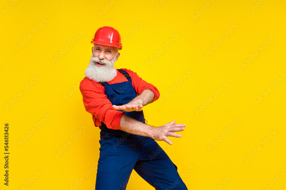 Photo of grandfather workman dancing party after finishing renewing house isolated on bright color background