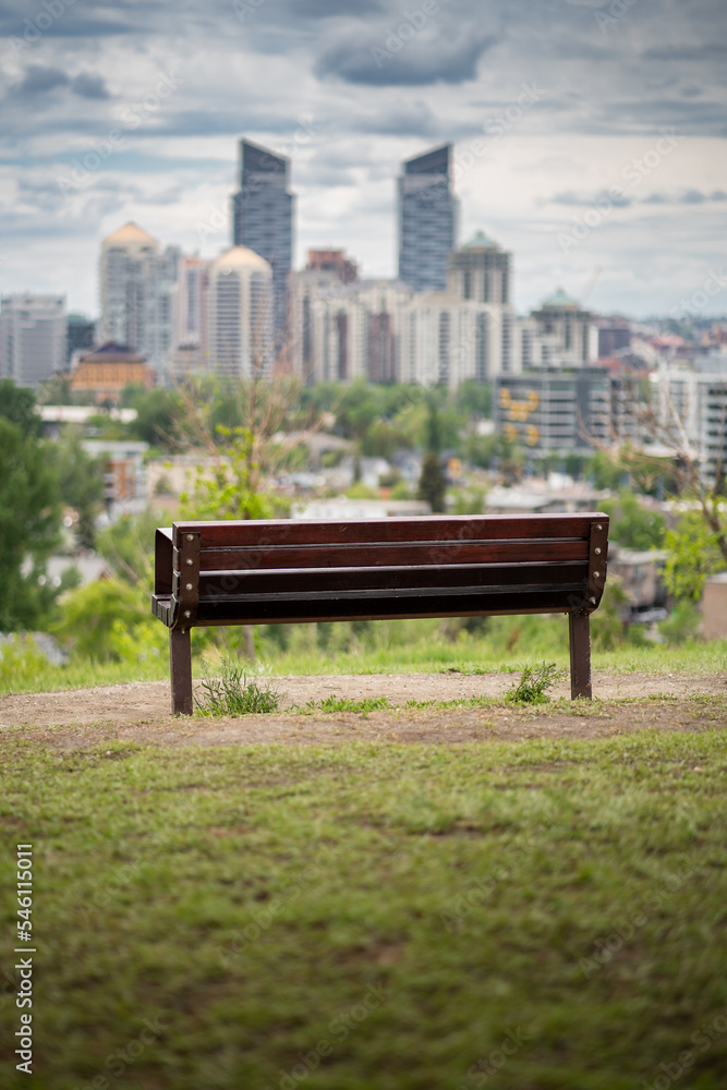 A park bench overlooking the downtown Calgary skyline and popular landmarks in Alberta Canada. A park bench overlooking the downtown Calgary skyline and popular landmarks in Alberta Canada.