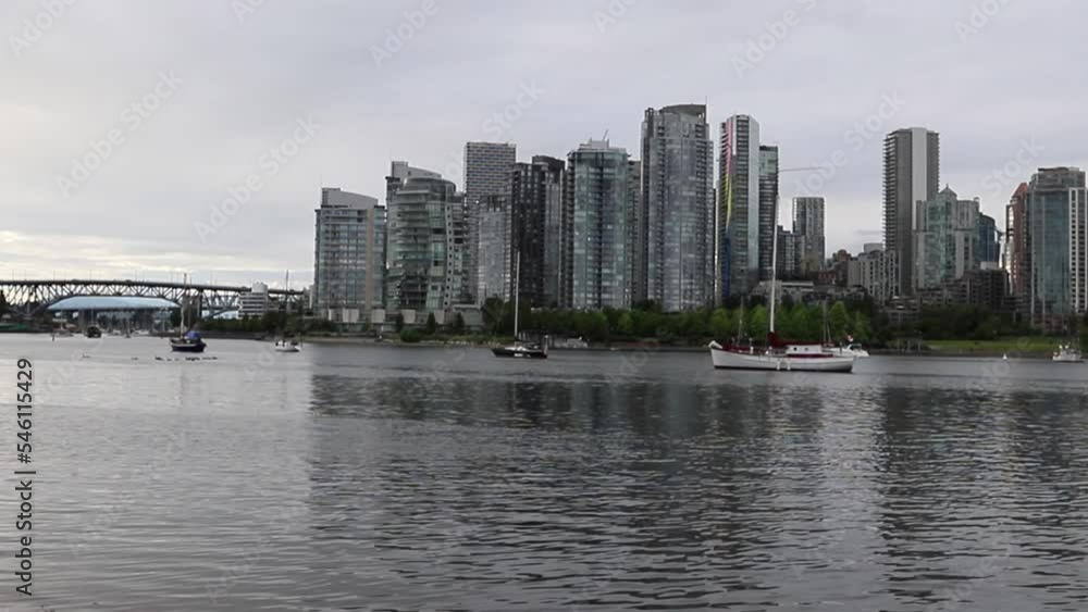 Panorama of the city - skyscrapers, condos, apartments, a calm lake and a marina. day time Panorama of the city - skyscrapers, condos, apartments, a calm lake and a marina. day time