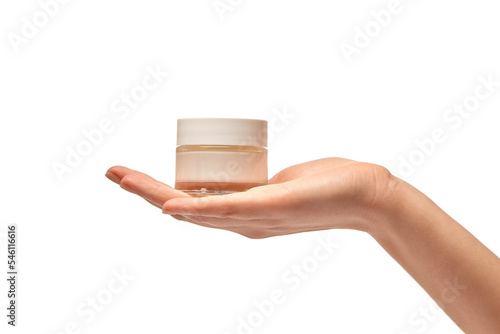 Female Hand Holding Jar Of Cream