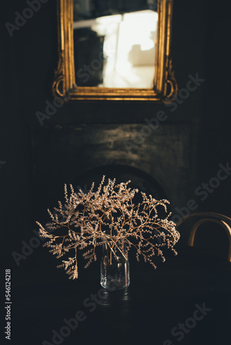 Dry flowers composition on the wooden table.