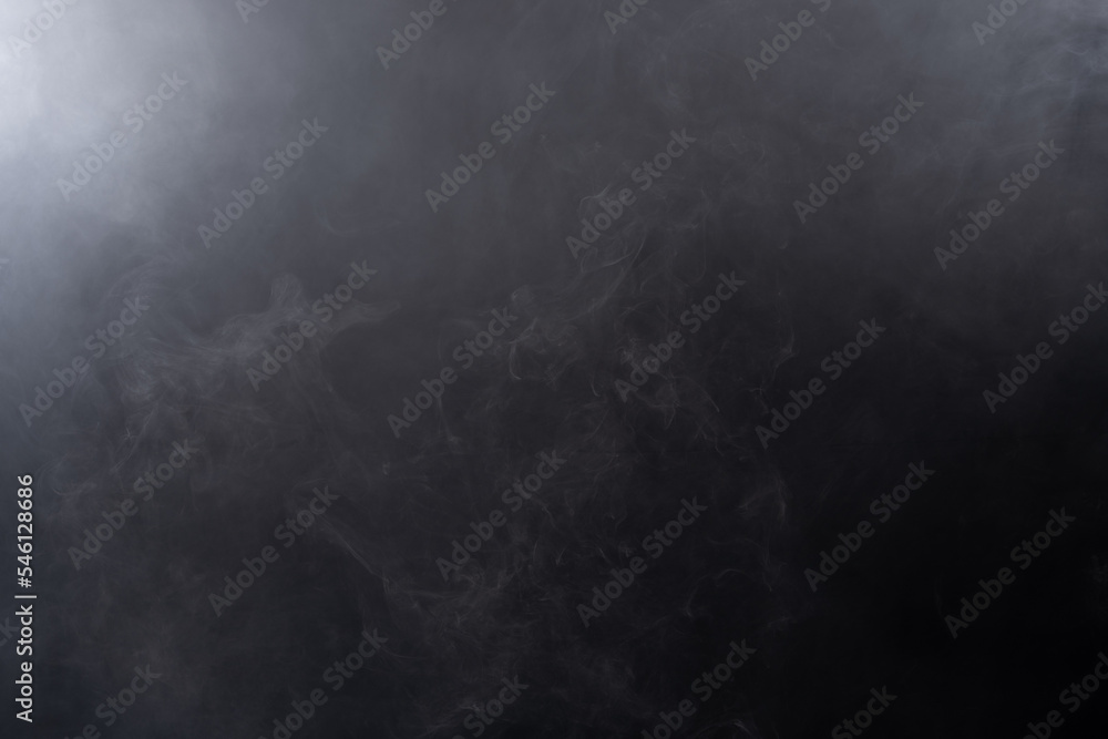 Dense Fluffy Puffs of White Smoke and Fog on black Background, Abstract Smoke Clouds, Movement Blurred out of focus. Smoking blows from machine dry ice fly fluttering in Air, effect texture