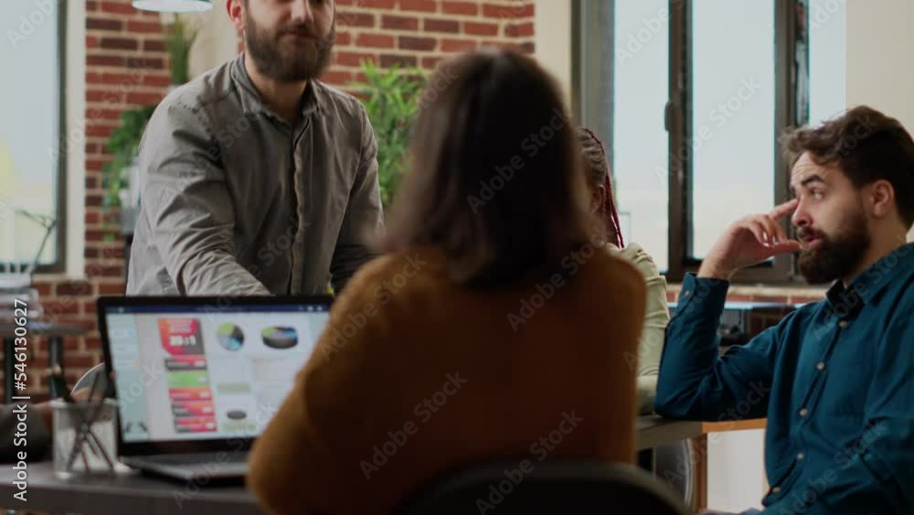 Aggressive manager being angry and throwing papers at employees, being stressed about having breakdown at business meeting with colleagues. Mad furious boss shouting at people.