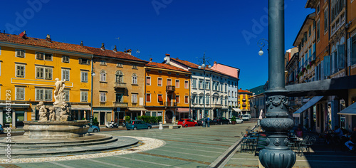 View of central square of Gorizia Piazza della Vittoria (Victory Square) with Neptune Fountain at sunny day, Italy photo