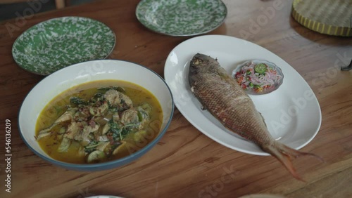 Indonesian Balinese Traditional Cuisine Food - Grilled Fish Whole and Soup photo