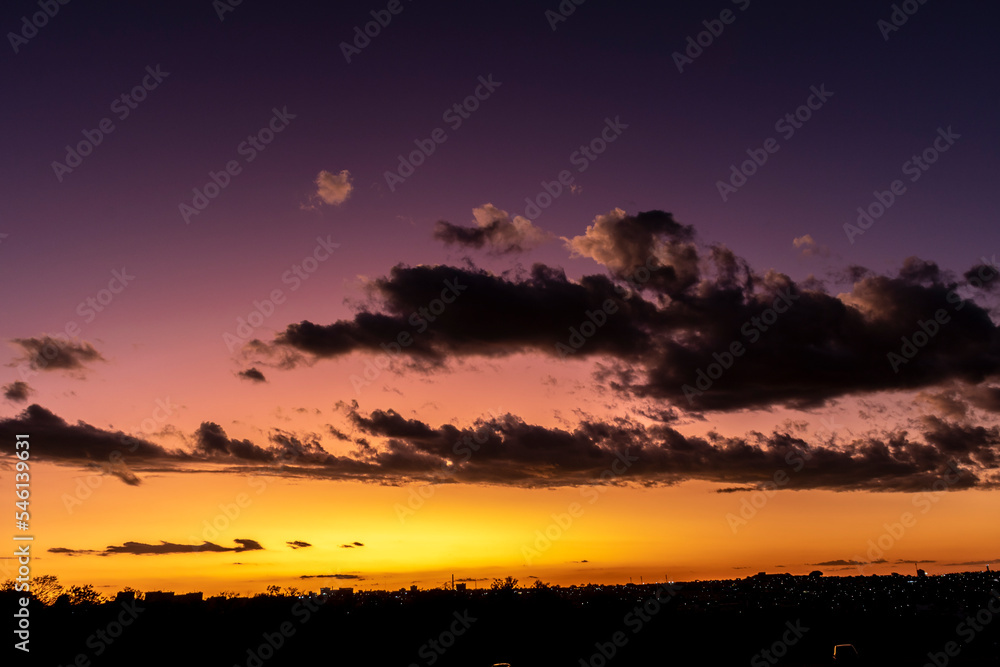 Sunset in the sky with clouds,  Awesome epic landscape. Amazing vibrant colors im Brazil