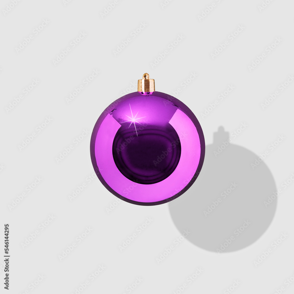 Purple New Year's ball on a white background. Minimal concept of Christmas