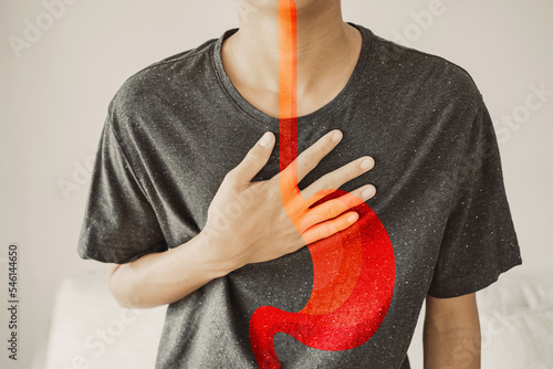 Young man having  heartburn, Gastroesophageal reflux disease (GERD) or acid reflux symptom, health care concept