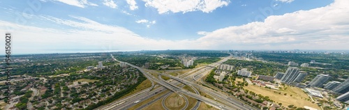 Highway aerial with multiple lanes roads and bridges. High speed car traffic in North America Canada. Transportation traffic at multilevel high speed road complex. © desertsands