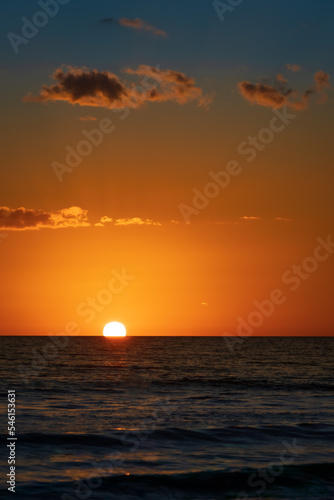 Fototapeta Naklejka Na Ścianę i Meble -  Sun Almost Setting into the Gulf of Mexico off Siesta Key