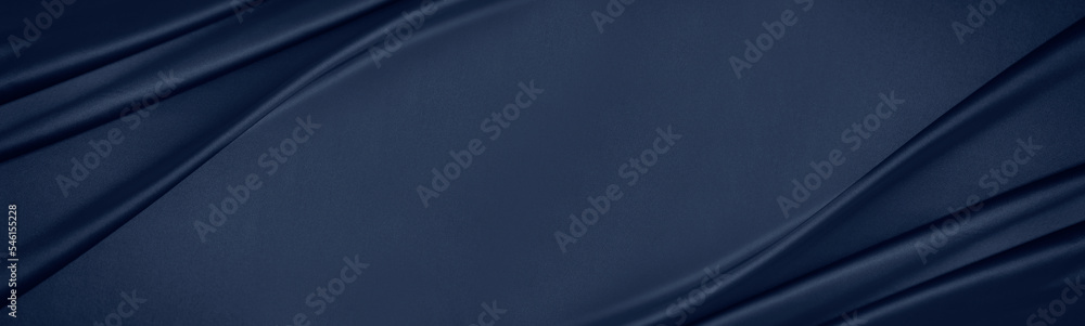 Dark blue silk satin. Soft folds. Fabric. Navy blue luxury background. Space for design.Wavy lines.Banner. Wide.Long. Flat lay, top view table. Beautiful. Elegant. Birthday, Christmas, Valentine's Day