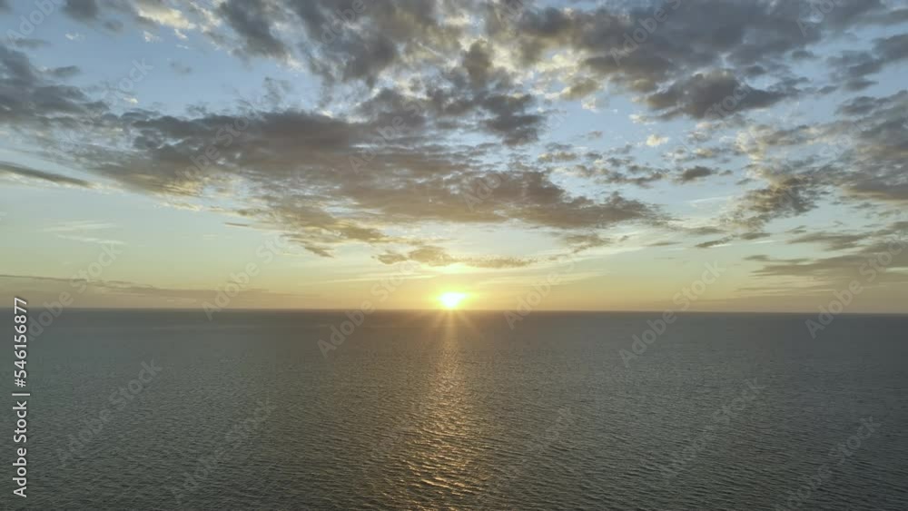Sun Setting Down in the Ocean with a Beautiful Orange Sky with a Clear Horizon a Top Drone shot Dollying in
Sun Setting Down in the Ocean with a Beautiful Orange Sky with a Clear Horizon a Top Drone shot Dollying in