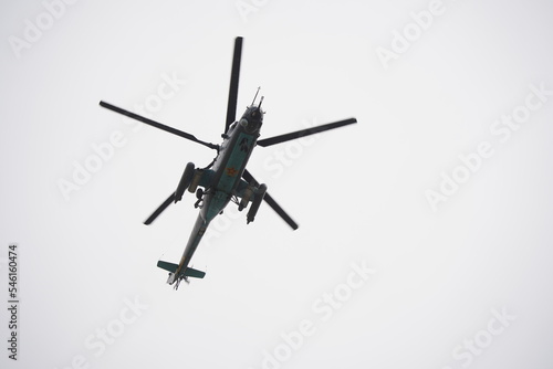 Almaty, Kazakhstan - 04.14.2022 : A military helicopter flies over the training ground during an exercise.