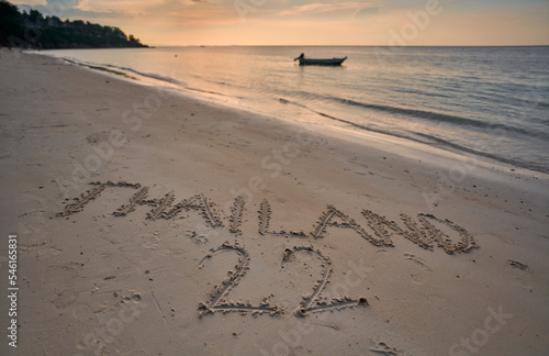 Writing in sand at a beach Thailand 2022