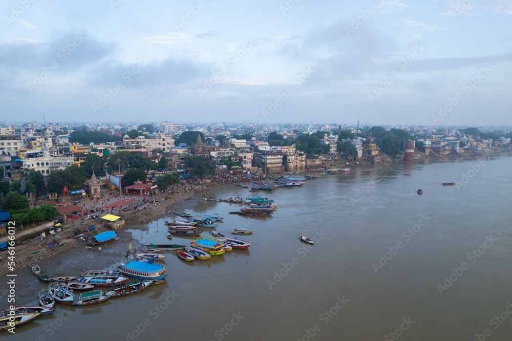 Naklejka premium Aerial view of Varanasi city with Ganges river, ghats, the houses in Varanasi, Banaras, Uttar Pradesh, India