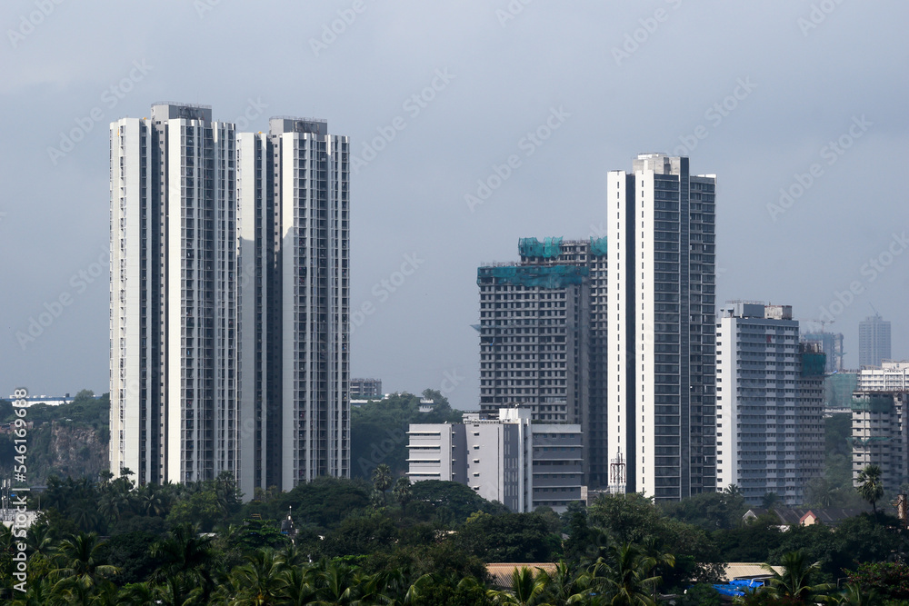 A skyline of modern concrete high rise skyscrapers in the suburb of Kandivali East in the city of Mumbai.