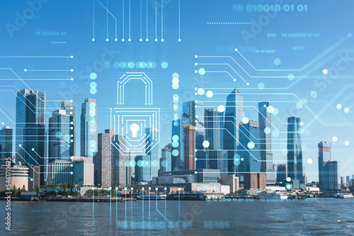 New York City skyline from New Jersey over the Hudson River towards the Hudson Yards at day. Manhattan  Midtown. The concept of cyber security to protect confidential information  padlock hologram