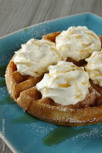 Waffles with whipped butter and maple syrup