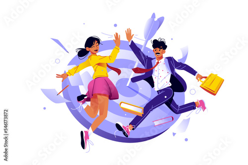 Man and woman colleagues jumping and giving high five