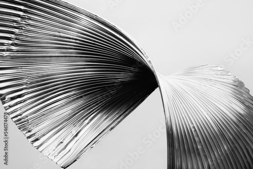 Art piece. Monochrome wallpaper. Embossed iron. Black white silver color gradient light on ridged curved metal texture industrial abstract illustration background. 3d render