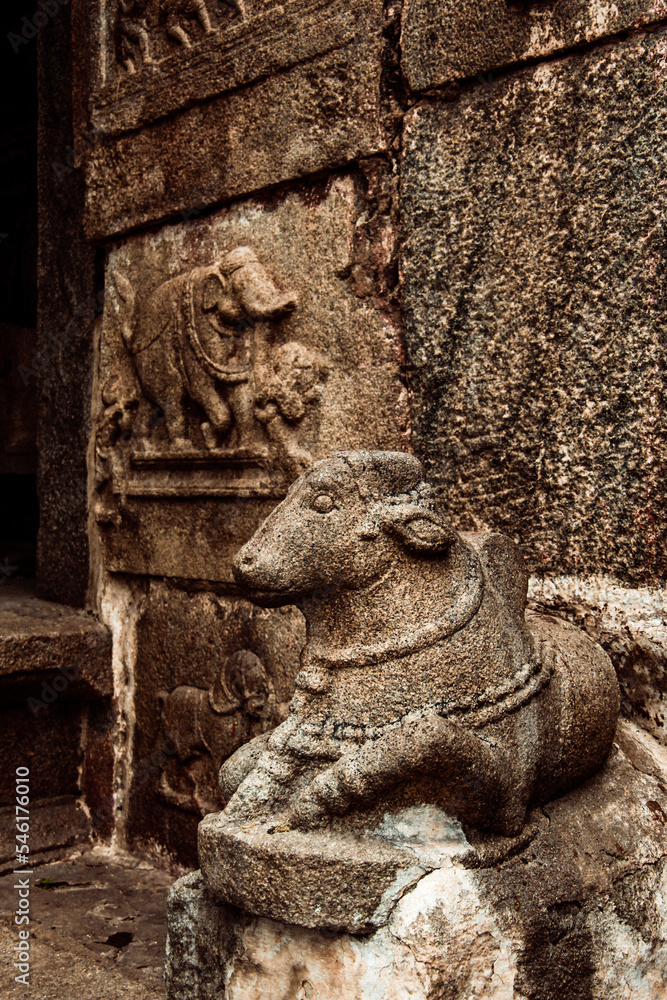 Nandi statue with architecture at main gopuram or gopura at Virupaksha temple hampi karnataka india. unesco world heritage site