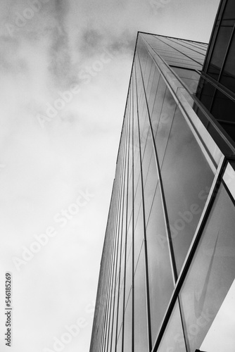 street photo of tall building against grey clouds