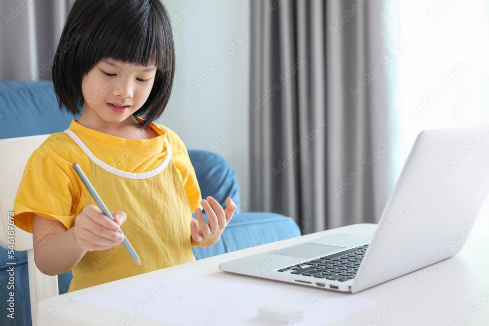 little asian girl student study online using laptop computer at home little asian girl student study online using laptop computer at home
