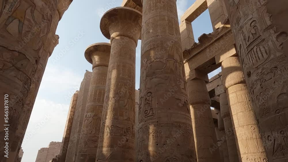 Rows of columns in Great Hypostyle Hall in Karnak temple, hieroglyphs on ancient Egyptian pillars Rows of columns in Great Hypostyle Hall in Karnak temple, hieroglyphs on ancient Egyptian pillars