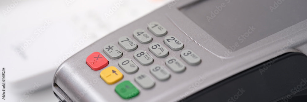 POS terminal for payment with wire closeup POS terminal for payment with wire closeup