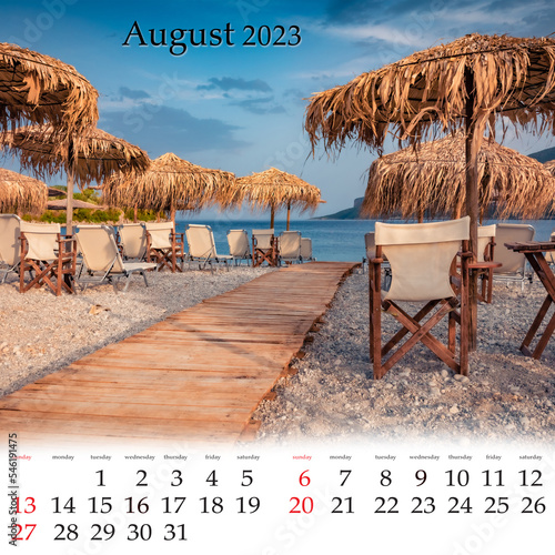 Square wall monthly calendar ready for print, August 2023. Set of calendars with beautiful landscapes.  Empty Fokianos beach with wooden pier and straw umbrellas, Peloponnese peninsula, Greece,. photo