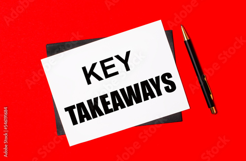 Black pen, envelope and white card with the text KEY TAKEAWAYS on a bright red background