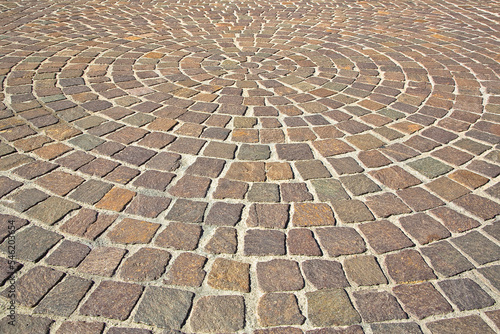 Photos New paving made with porphyry stone blocks of cubic shape in a pedestrian zone