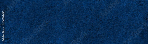 Navy blue rough wall wide panoramic texture. Indigo color dramatic abstract textured background