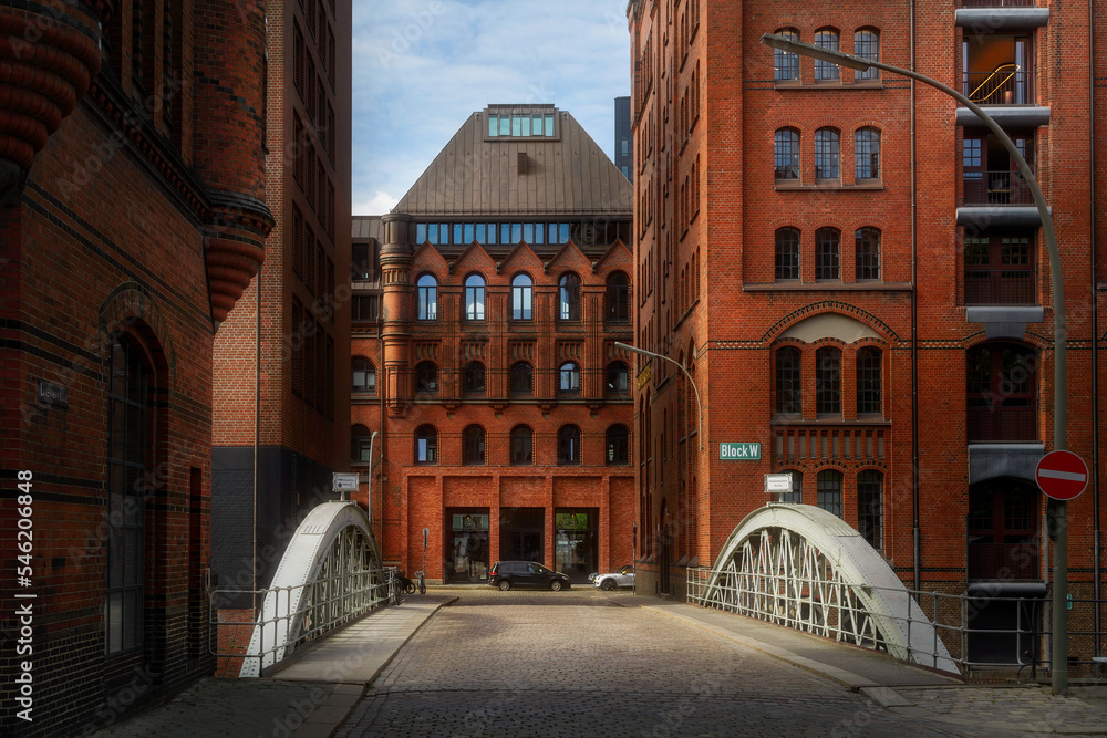 View of brick houses with windows and bridge in Hamburg, Germany. Architecture. Travel.