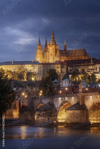 Sticker Prague Castle and Charles bridge with dramatic clouds at night, Czech Republic
