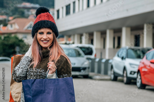 young woman wearing winter clothes shopping