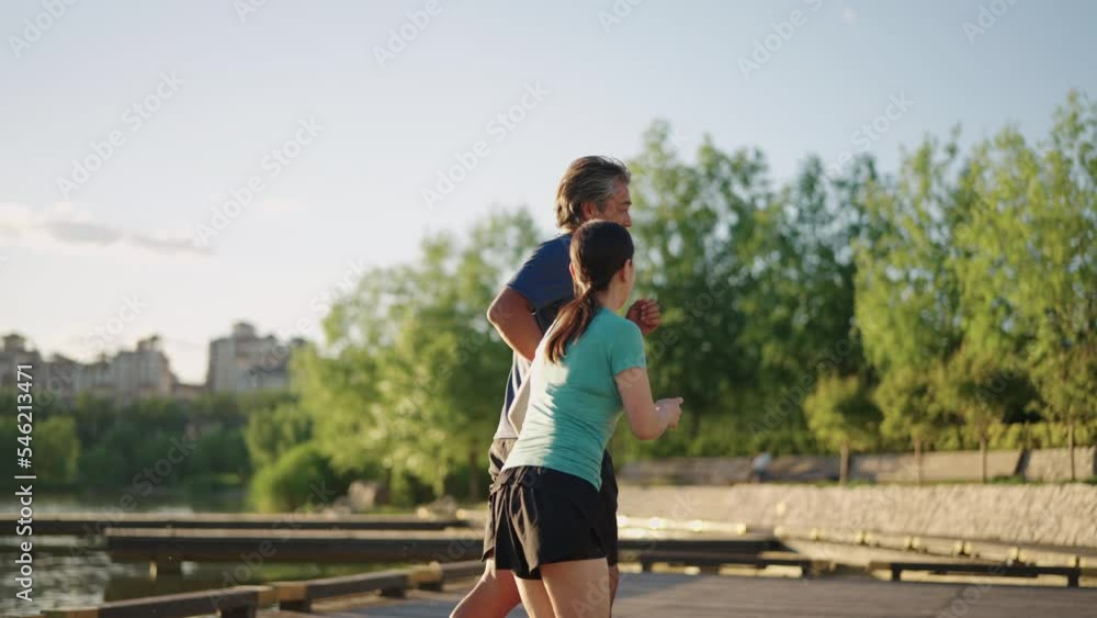Mature couple getting ready to jog Mature couple getting ready to jog